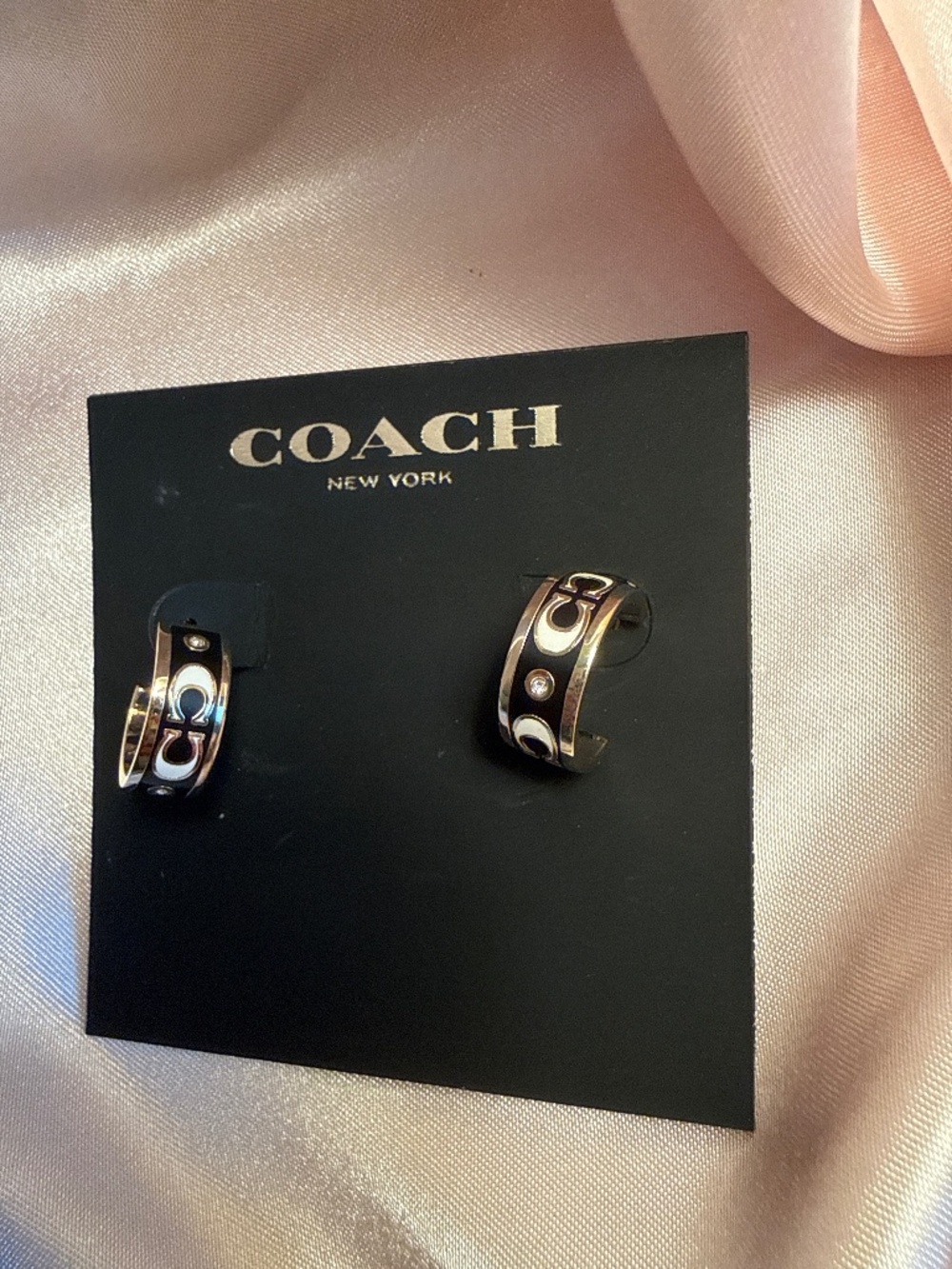Black and silver Coach Huggies